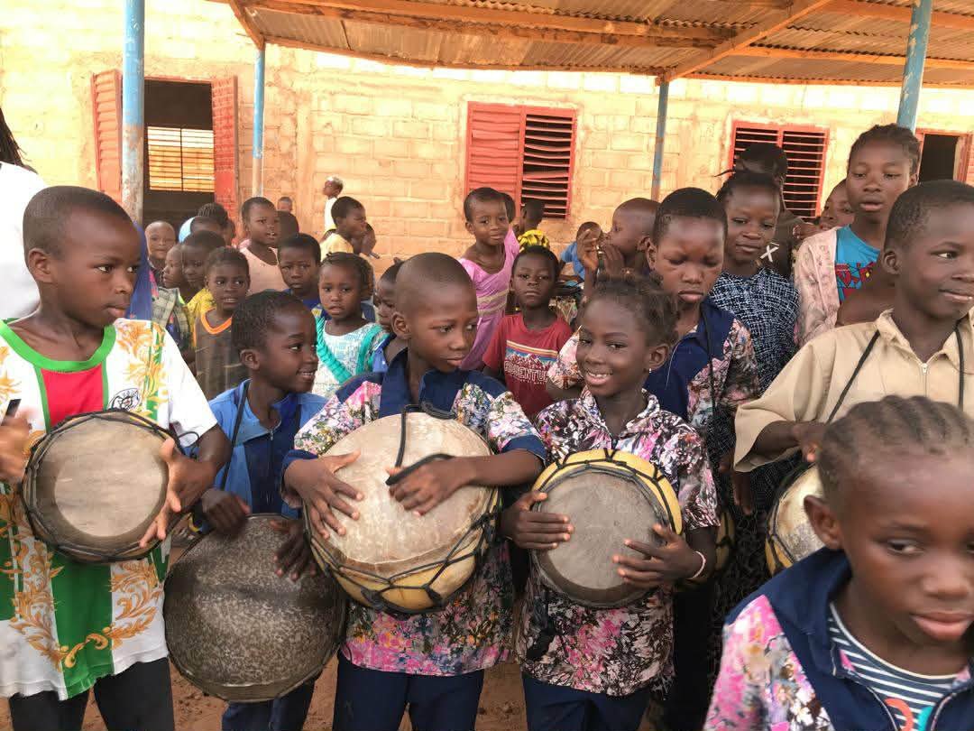 Children of Ouagadougou holding traditional drums